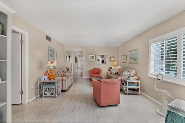 living room with light hardwood / wood-style flooring