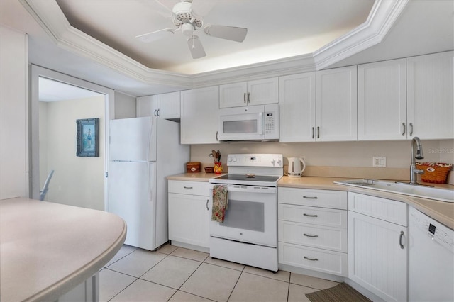 kitchen with white cabinetry, a raised ceiling, white appliances, and sink