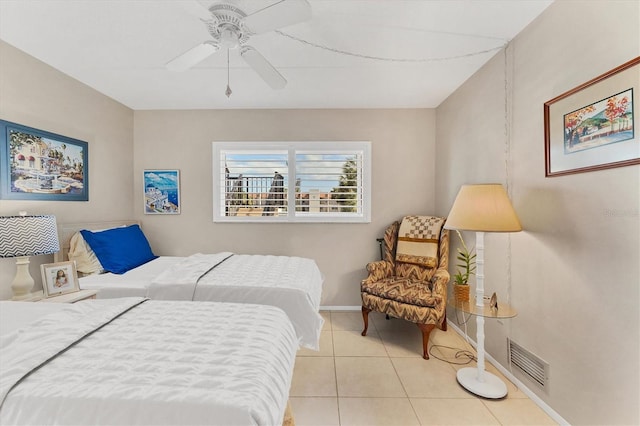 tiled bedroom with ceiling fan