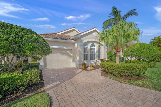 view of front of property with a garage