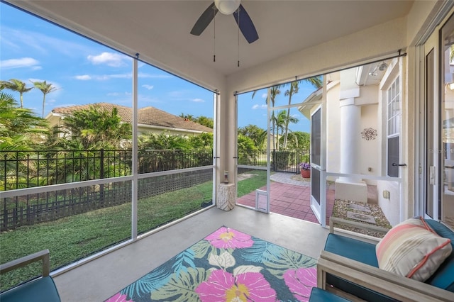 sunroom with ceiling fan