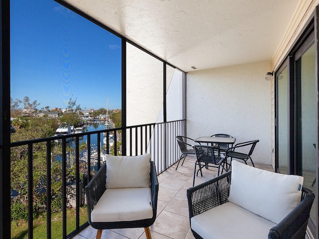 balcony featuring a water view