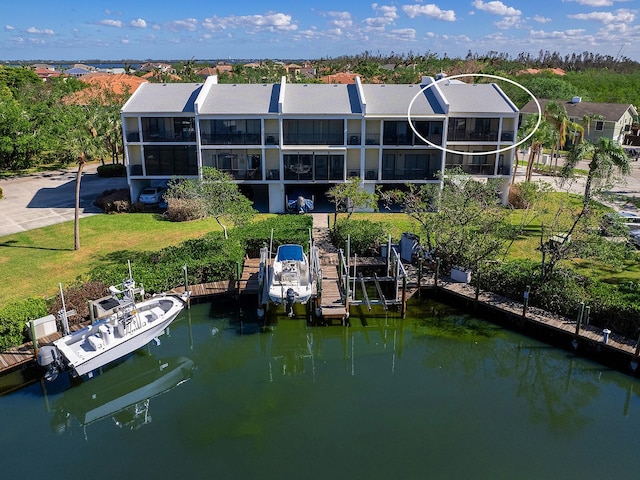 rear view of house featuring a water view