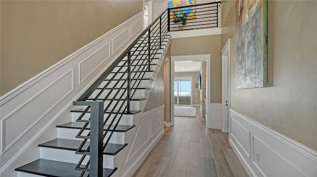 stairway featuring hardwood / wood-style flooring