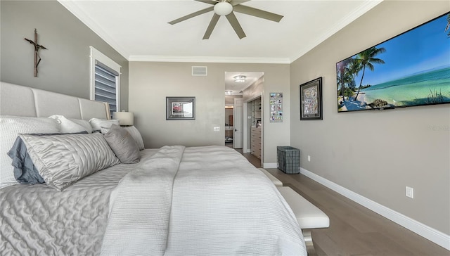 bedroom featuring ceiling fan, hardwood / wood-style floors, and crown molding