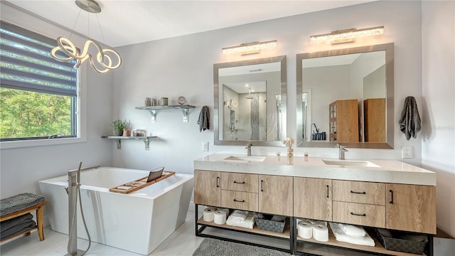 bathroom with vanity and independent shower and bath