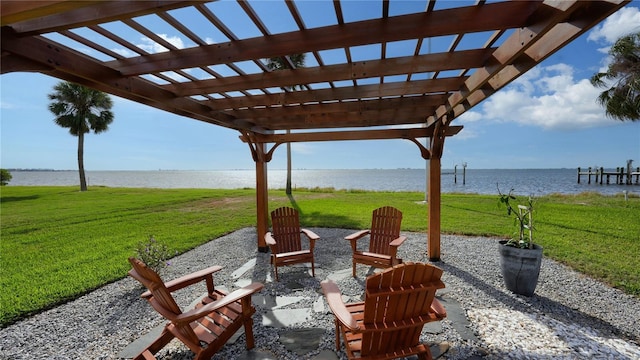 view of patio with a water view and a pergola