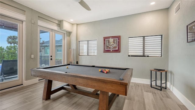 recreation room featuring light wood-type flooring, visible vents, ceiling fan, and baseboards