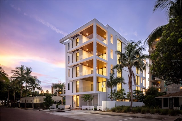 view of outdoor building at dusk