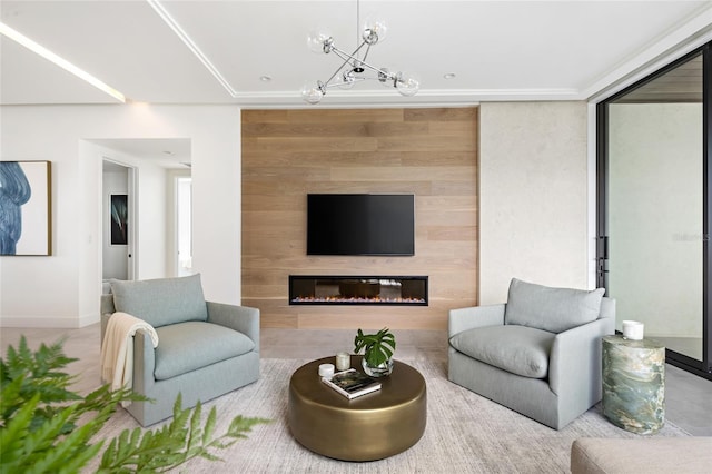 509 Golden Gate Pt Unit 3, Sarasota, FL 34236 - living room with a chandelier, baseboards, and a glass covered fireplace
