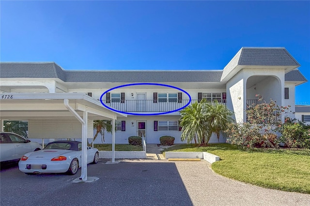 view of building exterior featuring a carport