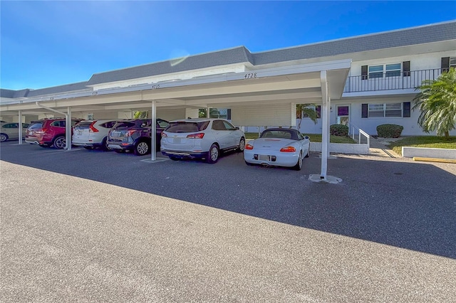 view of parking / parking lot featuring a carport