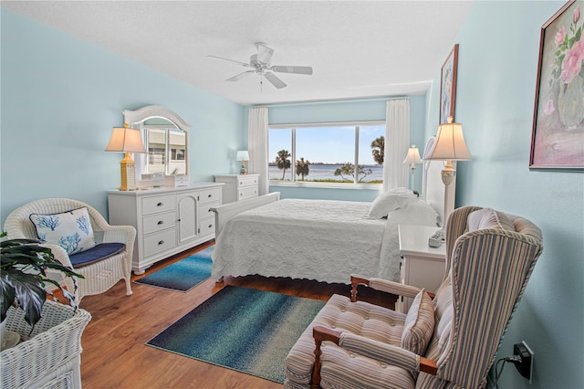 bedroom featuring hardwood / wood-style floors and ceiling fan