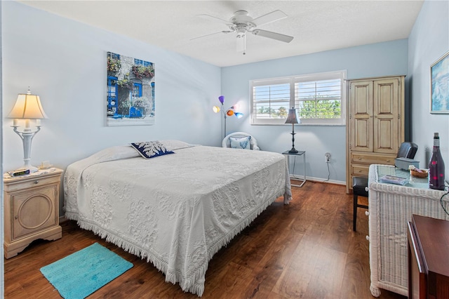 bedroom featuring ceiling fan and dark hardwood / wood-style flooring