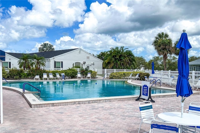 view of swimming pool with a patio area