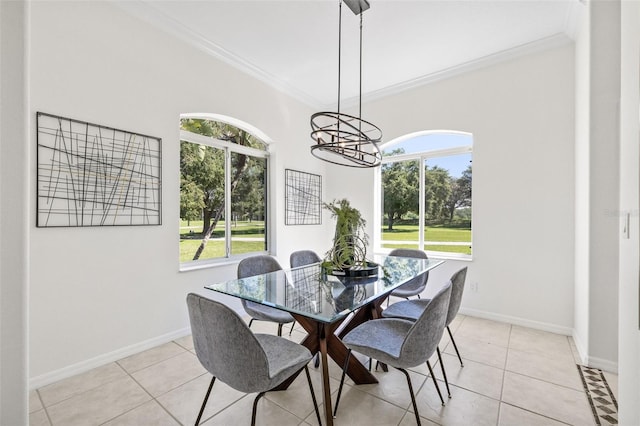 tiled dining room with a wealth of natural light and ornamental molding