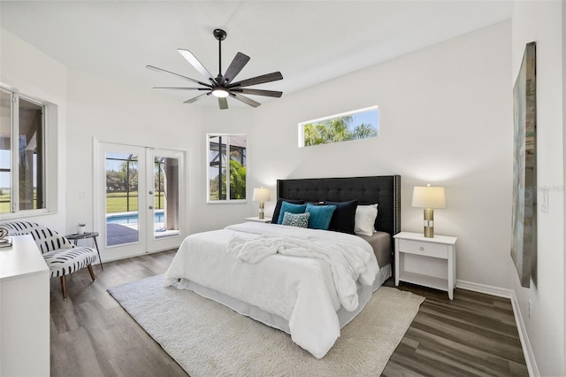 bedroom featuring access to exterior, french doors, dark hardwood / wood-style flooring, and ceiling fan