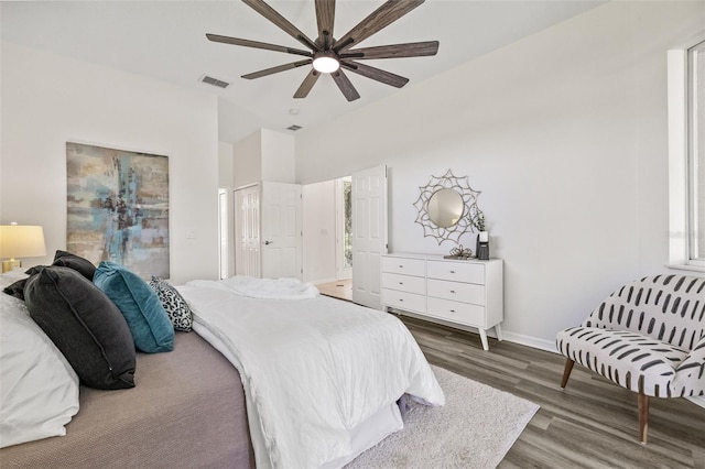 bedroom with ceiling fan and dark hardwood / wood-style flooring