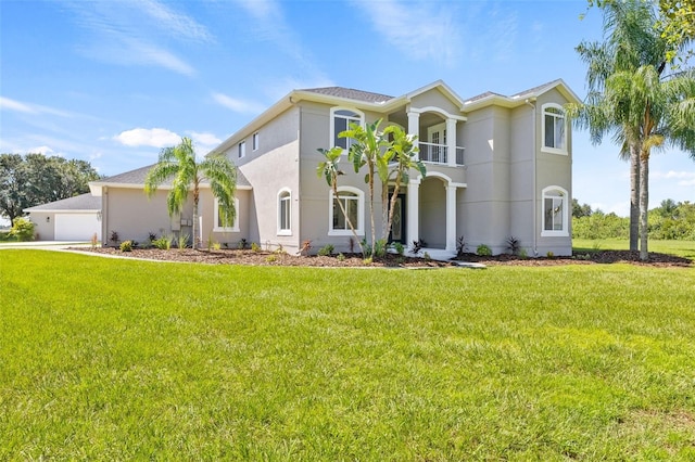 mediterranean / spanish-style house featuring a balcony and a front lawn