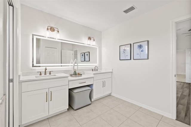 bathroom with vanity and tile patterned floors