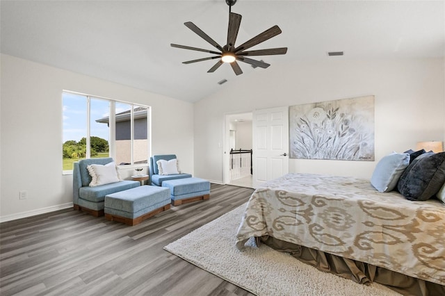 bedroom with hardwood / wood-style floors, ceiling fan, and vaulted ceiling