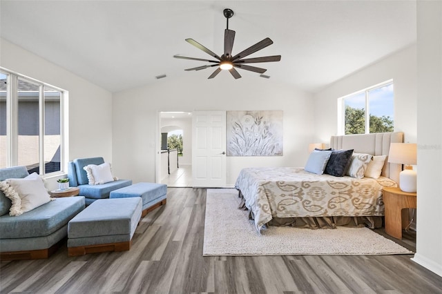 bedroom featuring wood-type flooring, ceiling fan, and lofted ceiling