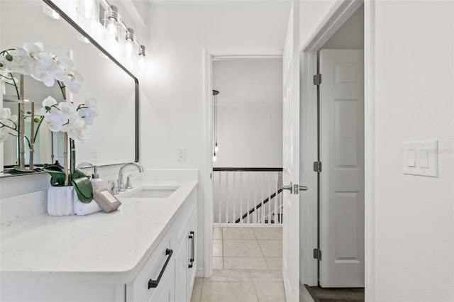 bathroom featuring tile patterned flooring and vanity