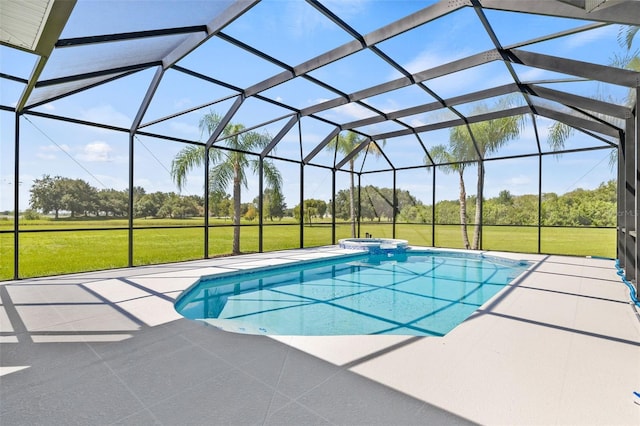 view of pool with a yard, a patio, and a lanai