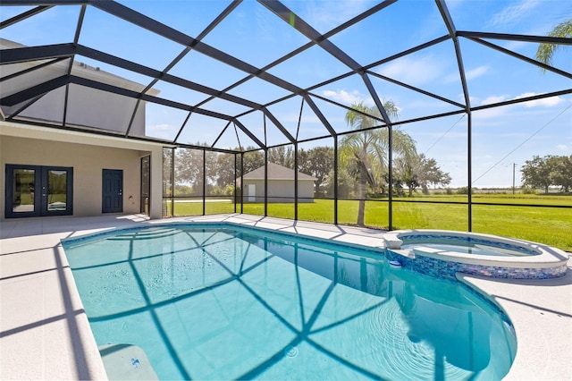 view of pool with a lanai, a yard, an in ground hot tub, and french doors