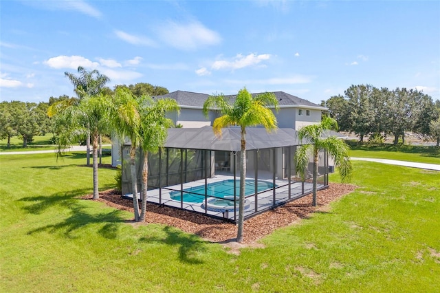 view of swimming pool with a lanai, a lawn, and a patio