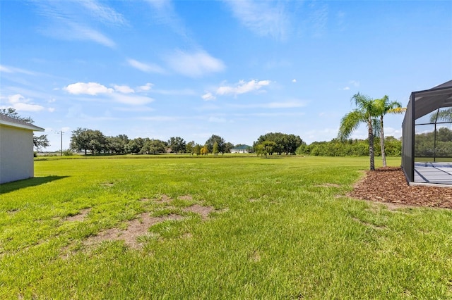 view of yard featuring a lanai