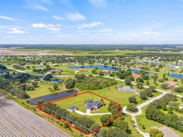 drone / aerial view featuring a water view