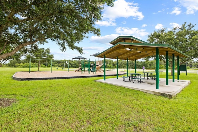 view of community featuring a lawn and a playground