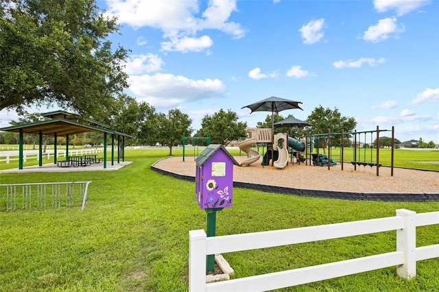 view of playground with a lawn