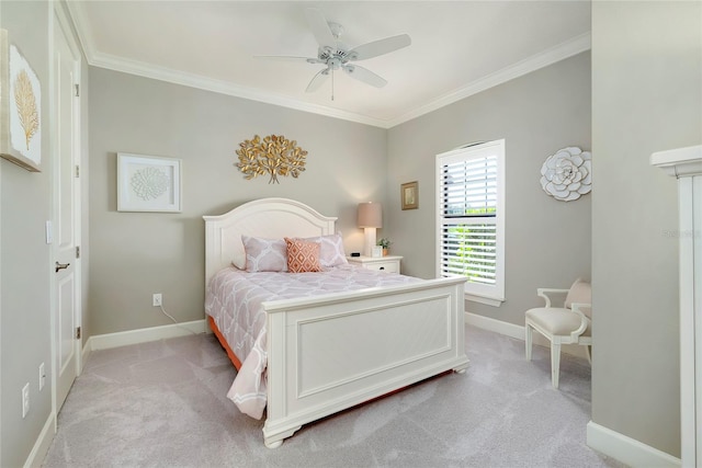 carpeted bedroom with ceiling fan and crown molding