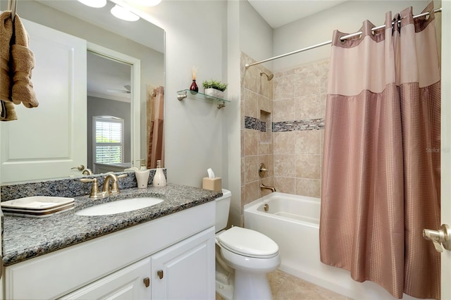 full bathroom featuring toilet, vanity, tile patterned floors, and shower / bath combo with shower curtain