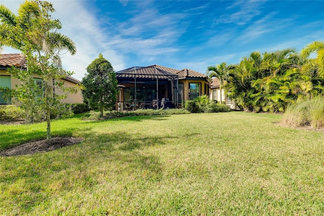 view of yard with a lanai