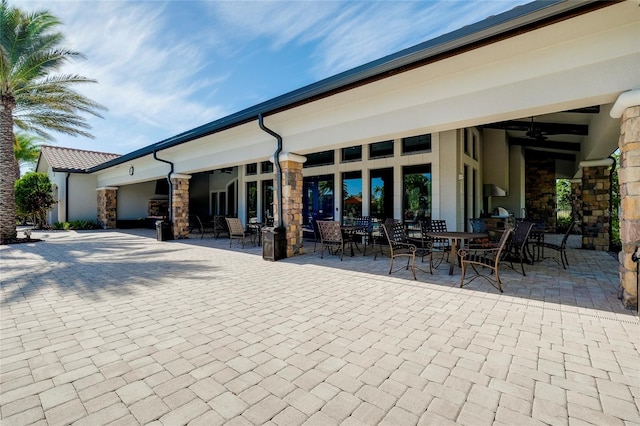 exterior space with a patio area and ceiling fan