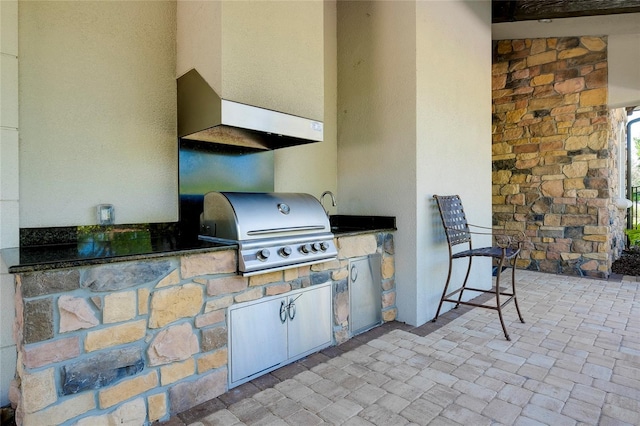 view of patio featuring area for grilling and sink