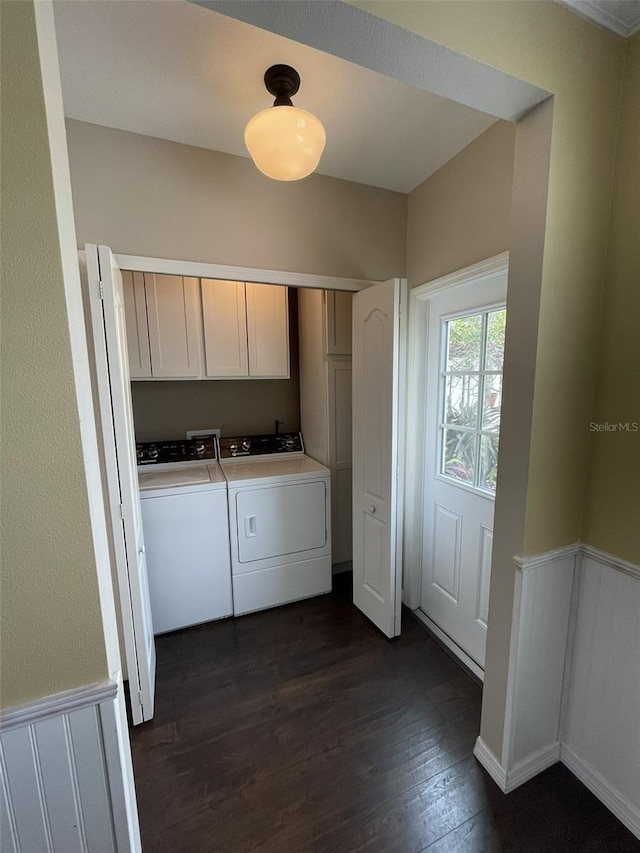 laundry area with cabinets, dark hardwood / wood-style floors, and independent washer and dryer