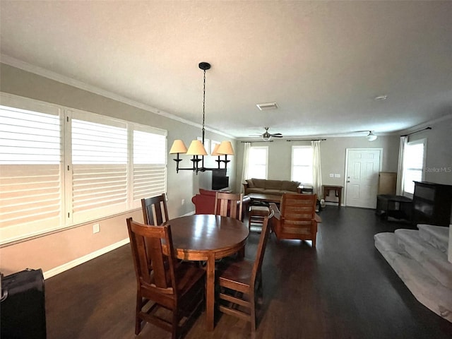 dining space with ceiling fan and ornamental molding