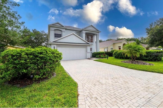 front facade with a front lawn