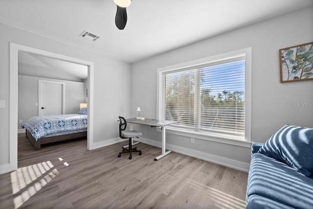 office area with ceiling fan and light hardwood / wood-style flooring