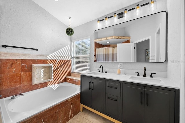 bathroom featuring plus walk in shower, tile patterned flooring, and vanity