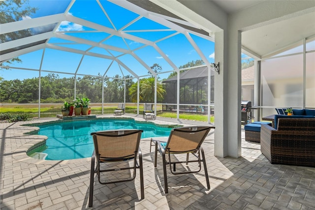 view of pool with a lanai and a patio