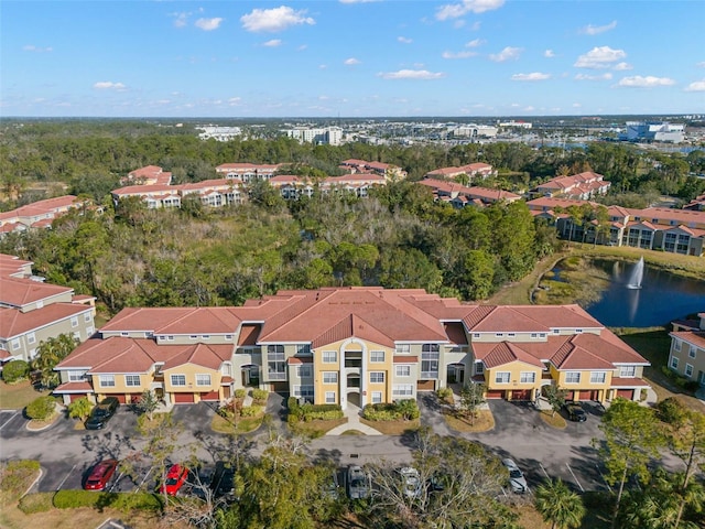 bird's eye view featuring a residential view and a water view