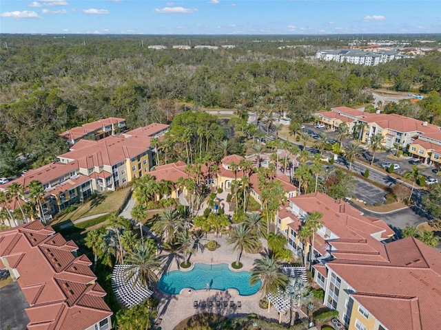 birds eye view of property with a residential view and a view of trees