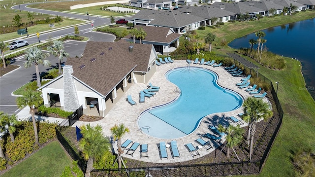 view of pool with a water view