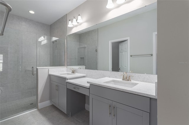 bathroom featuring tile patterned flooring, vanity, and an enclosed shower