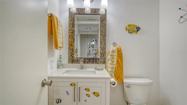 bathroom with vanity and toilet